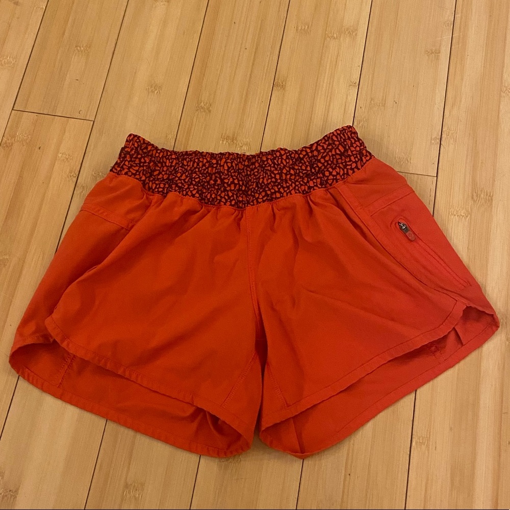 red/coral lululemon shorts with patterned waistband